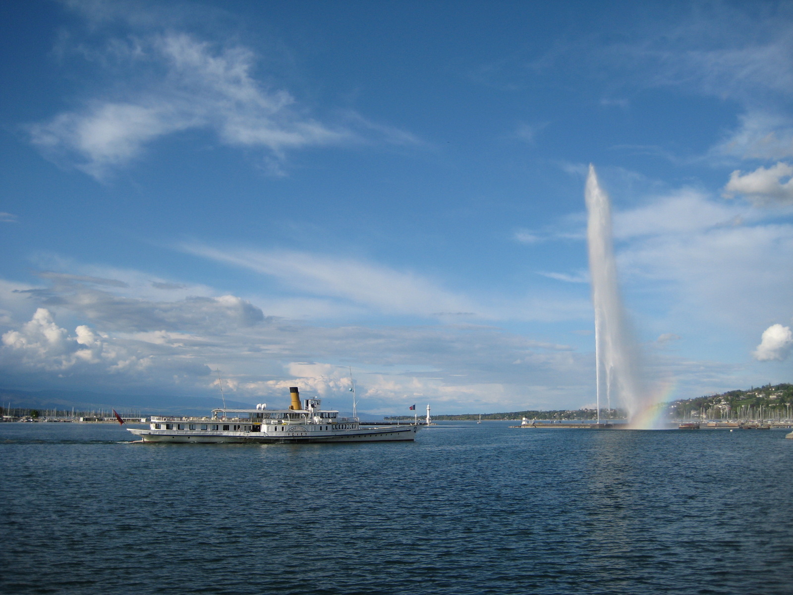 Lake Geneva with the Jet d’Eau and a passenger boat, photographed in 2009.